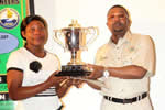 Tatenda Nengiwa being presented with the First Prize Trophy by the Minister of Tourism and Hospitality Honourable Engineer Walter Mzembi at the 2014 National Engineering Students Competition Awards.