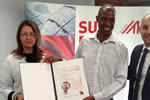 Clive Nyapokoto receiving his award from the Austrian Ambassador to south Africa Ambassador Brigitte Öppinger-Walchshofer