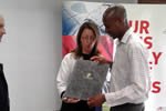 Clive Nyapokoto receiving his award from the Austrian Ambassador to south Africa Ambassador Brigitte Öppinger-Walchshofer