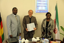 HIS EXCELLENCY THE AMBASSADOR OF THE ISLAMIC REPUBLIC OF IRAN MR MOHAMAD aminejad pose for pohotgraphs with the HIT Acting Vice Chancellor QC Kanhukamwe and the Registrar Mrs M Samupindi